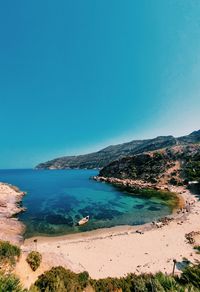 Scenic view of sea against clear blue sky