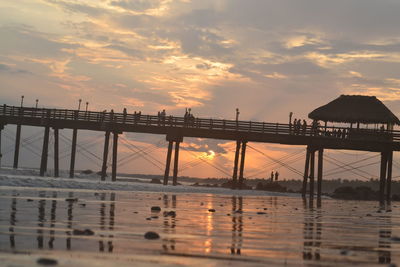 View of pier at sunset