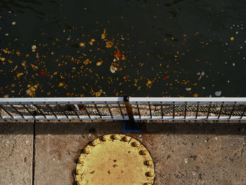 High angle view of text on wall by lake