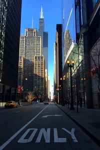 Street amidst modern buildings in city