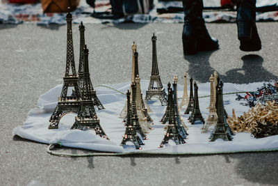 Close-up of eiffel tower decoration on fabric at market for sale