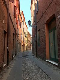 Narrow alley amidst buildings in town