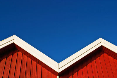 Houses against clear blue sky