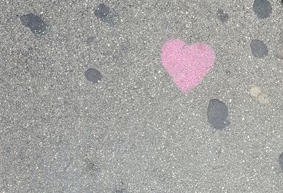 High angle view of heart shape on road