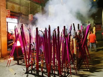 Close-up of burning candles in temple