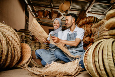 Portrait of smiling woman using mobile phone