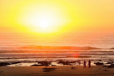 Scenic view of sea at sunset