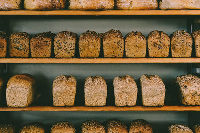 Loaves of bread on shelves.