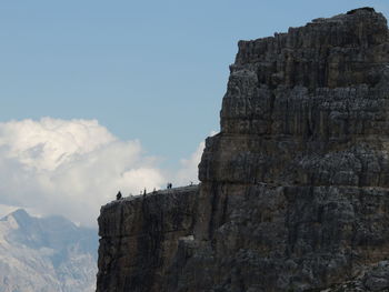 Low angle view of rock formation against sky