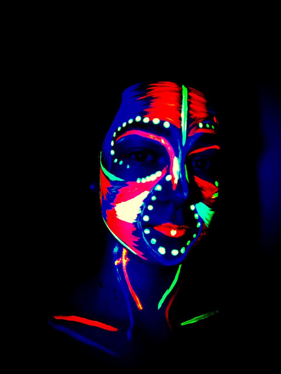 studio shot, black background, indoors, illuminated, multi colored, close-up, dark, paint, one person, headshot, copy space, neon, human body part, portrait, front view, face paint, body part, young adult, human face, light - natural phenomenon, obscured face, beautiful woman