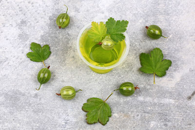 Gooseberry jelly on a gray stone background top view