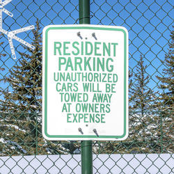 Warning sign on chainlink fence