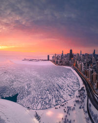 High angle view of city at sunset