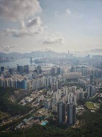 High angle view of buildings in city against sky