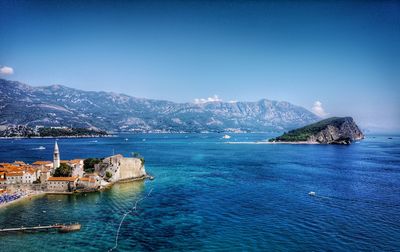 Scenic view of sea against clear blue sky