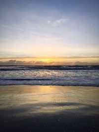 Scenic view of sea against cloudy sky