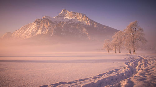 Scenic view of snow covered mountain against sky