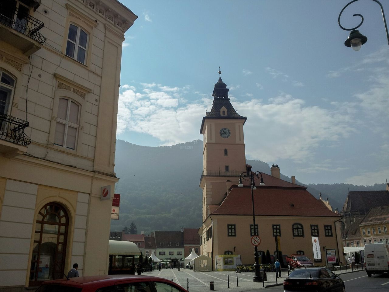 building exterior, architecture, built structure, church, religion, sky, transportation, mode of transport, place of worship, car, land vehicle, spirituality, dome, street, incidental people, cloud - sky, travel, day