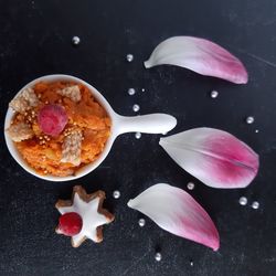 High angle view of pink roses on table