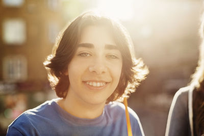 Portrait of happy teenage boy outdoors