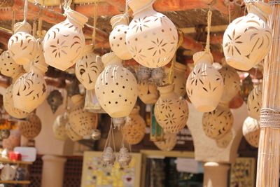 Close-up of decorations hanging in store for sale in market