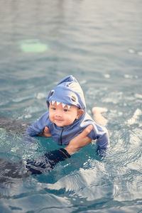 Portrait of boy swimming in pool