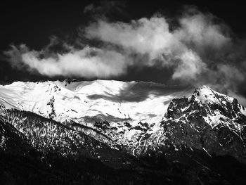 Scenic view of snowcapped mountains against sky