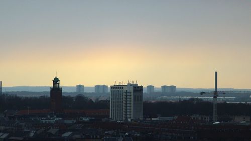 View of cityscape against sky during sunset