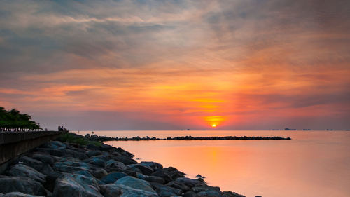 Scenic view of sea against sky during sunset