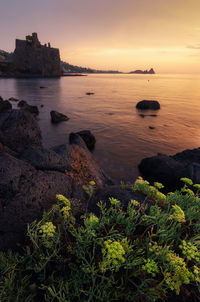 Scenic view of sea against sky during sunset