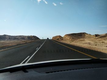 Road seen through car windshield