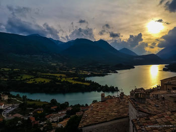 Scenic view of lake against sky during sunset