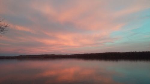 Scenic view of lake at sunset