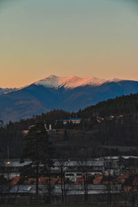 Scenic view of mountains against sky at sunset