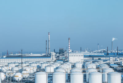 Factory against clear blue sky