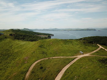 High angle view of road amidst landscape against sky