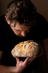 Close-up of boy eating bread