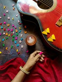 Midsection of woman playing guitar