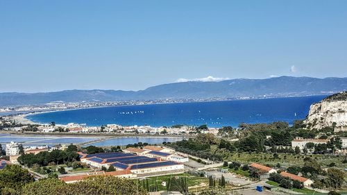 View of calm sea against clear blue sky