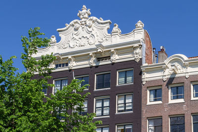 Low angle view of building against blue sky