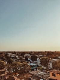 High angle shot of townscape against clear sky