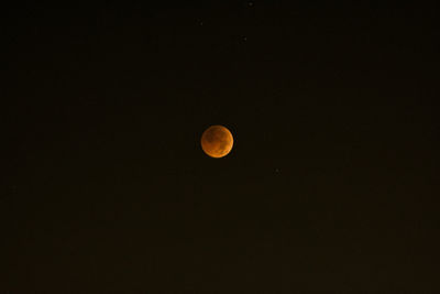 Low angle view of moon against sky at night