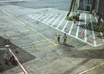 High angle view of people working at airport