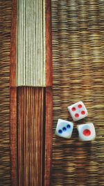 Directly above shot of dice on tatami mat