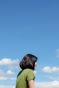 Rear view of woman against sky