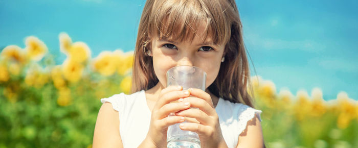 Young woman drinking water