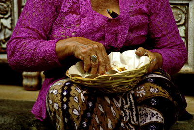 Close-up of hand holding purple food