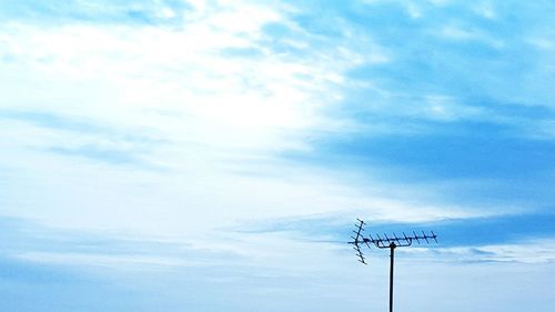 Low angle view of power lines against sky