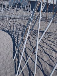 High angle view of metal fence on footpath