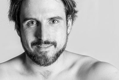 Close-up portrait of shirtless man